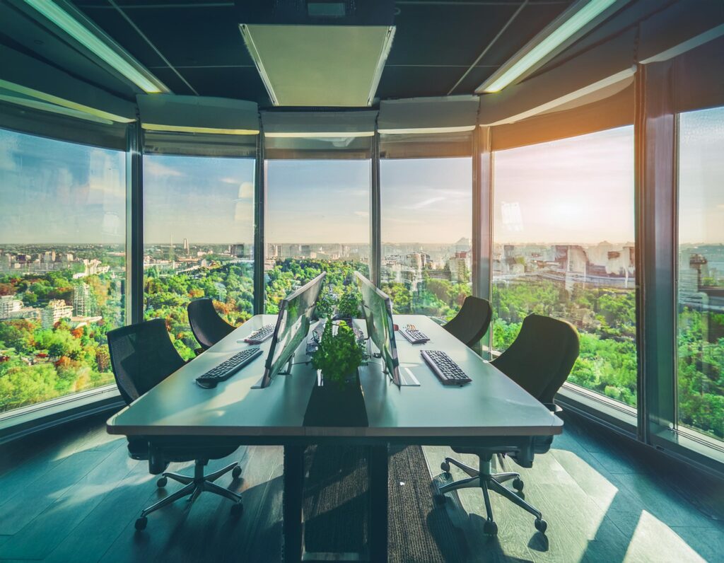 Firefly a sustainable technology office room of the future with a view to a green city from an interior space